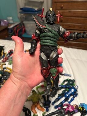 Black and Green Ninja Warrior Action Figure with Red Accents